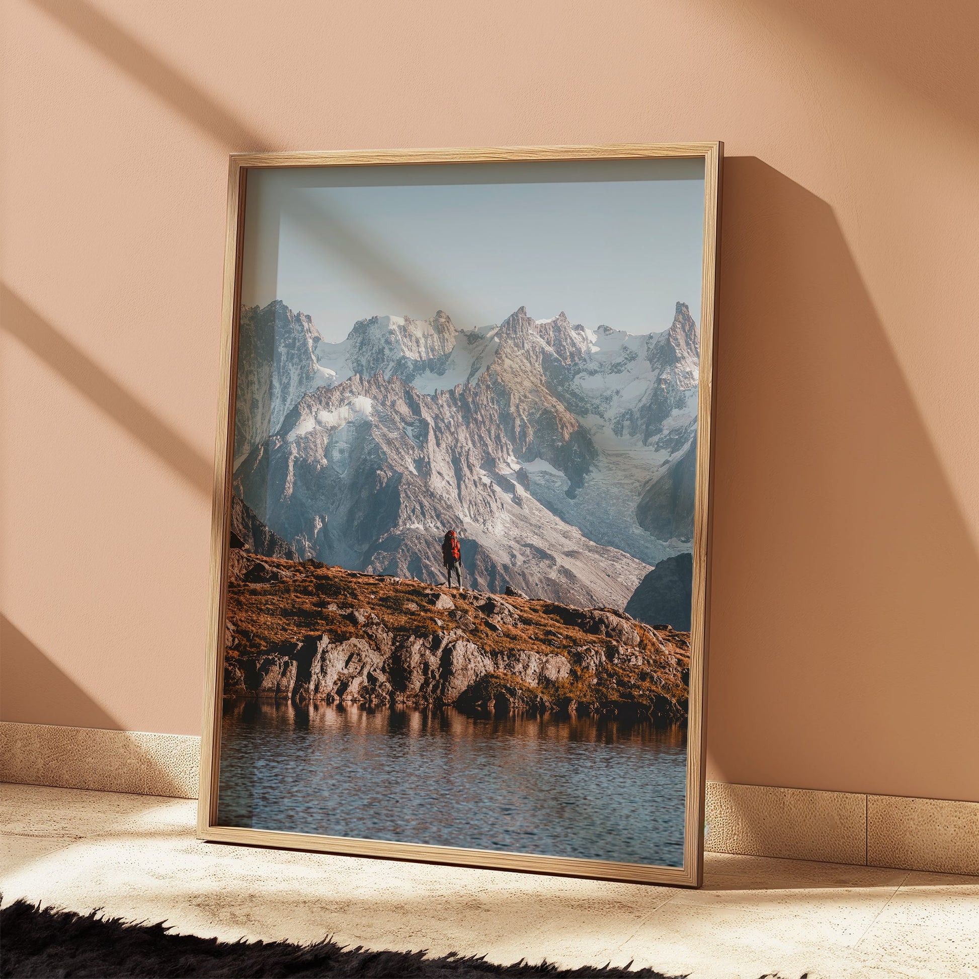 Tour du Mont Blanc sunrise hiking scene with golden light over snow-capped peaks.
