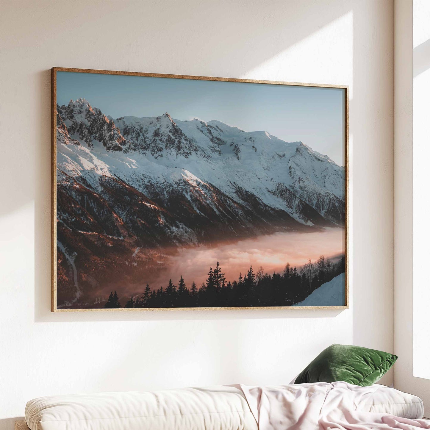 Chamonix Mont Blanc massif sunset print in a wooden frame above a modern living room sofa.