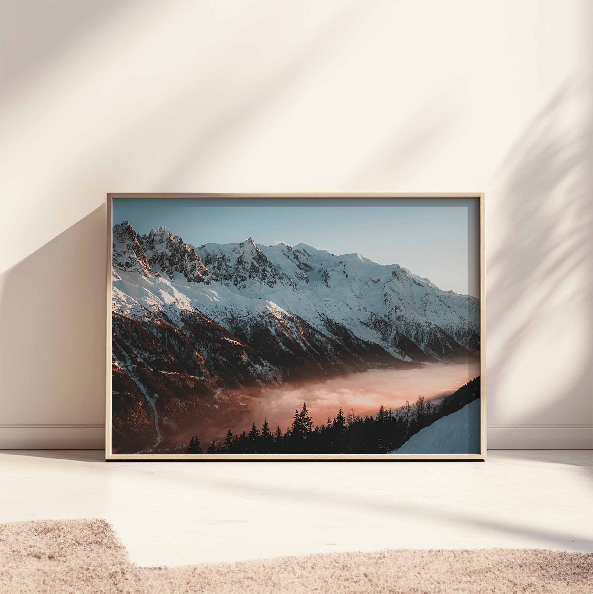 Soft sunset hues over Mont Blanc massif in a beige frame, bathed in natural light.