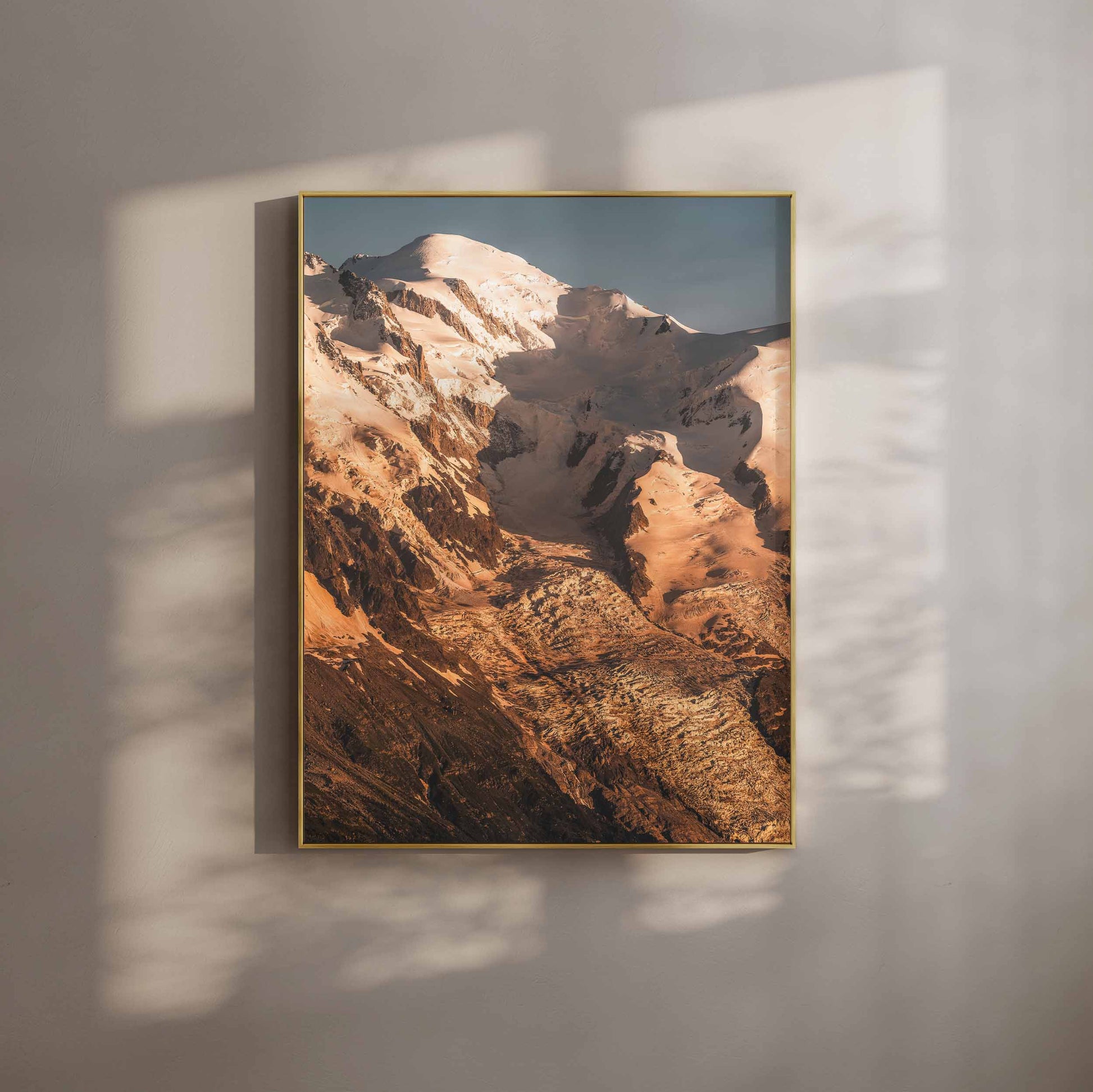 Mont Blanc illuminated by warm evening light, highlighting its majestic slopes