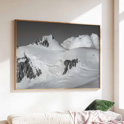 Elegant living room display with Mont Maudit black and white wall art, featuring snowy textures and alpine clouds.