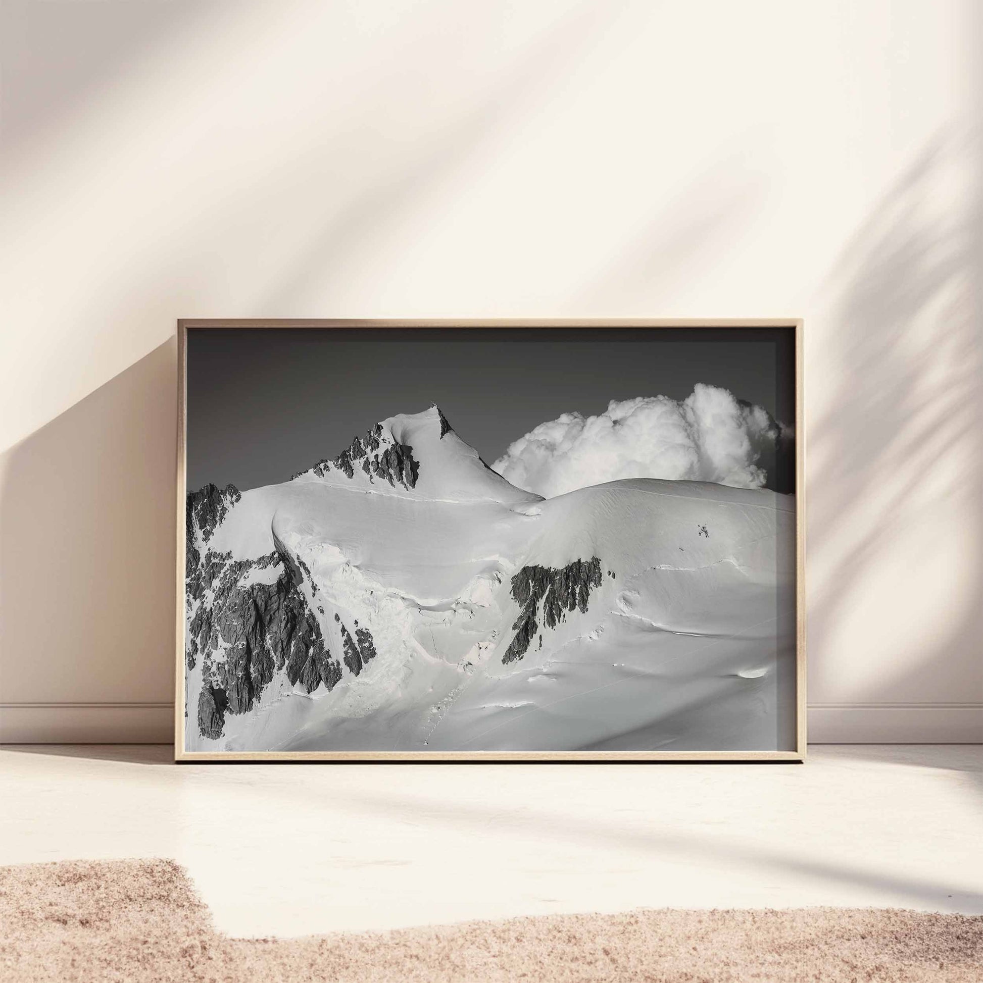 Chamonix's Mont Maudit black and white mountain print leaning on a bright wall, accentuating the snowy grandeur.