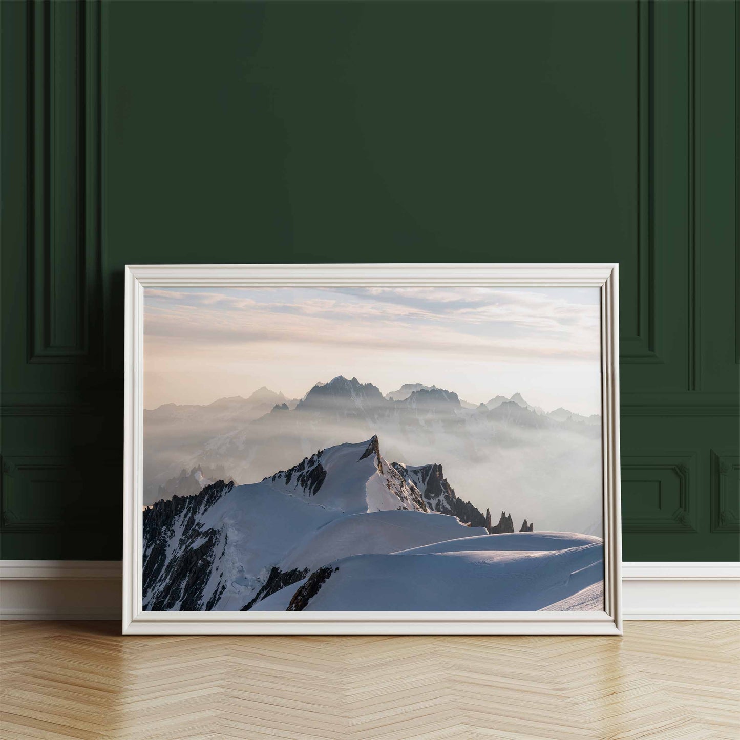 Mont Maudit summit view from Mont Blanc displayed as framed art against a dark green wall.