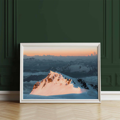 Close-up view of Monte Bianco di Courmayeur in a classic white frame, illuminated by sunrise.