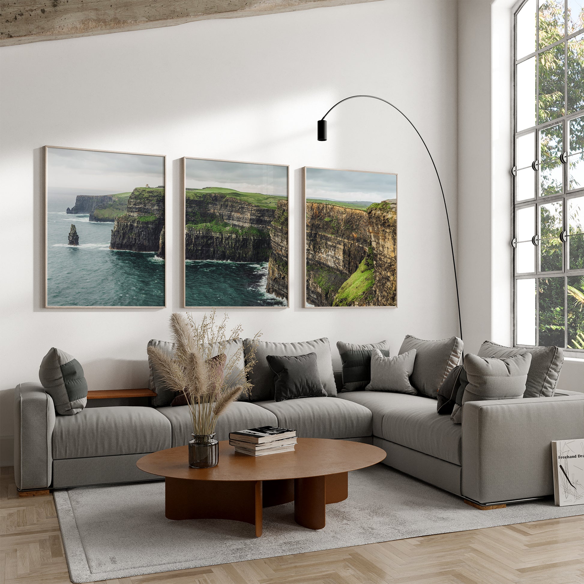 Full triptych of Cliffs of Moher above sofa in bright, modern living space