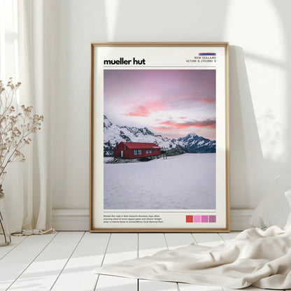 Mueller Hut alpine wall art print featuring a red mountain hut and soft pink sky in a minimalist home setting