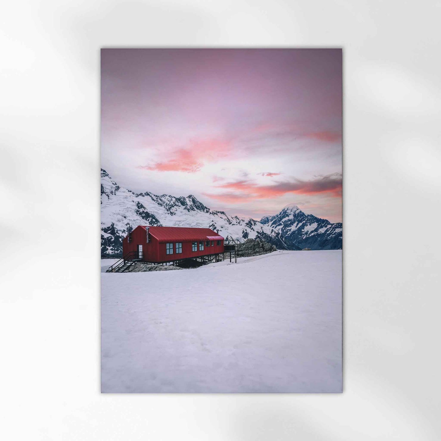 Unframed Mueller Hut fine art print on white background showing red mountain hut in snow with Aoraki Mount Cook at sunset