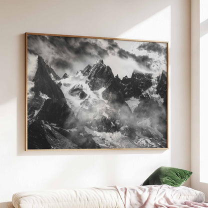 Black and white photograph of the Chamonix Needles, with jagged peaks emerging through clouds, in a contemporary wall setting.