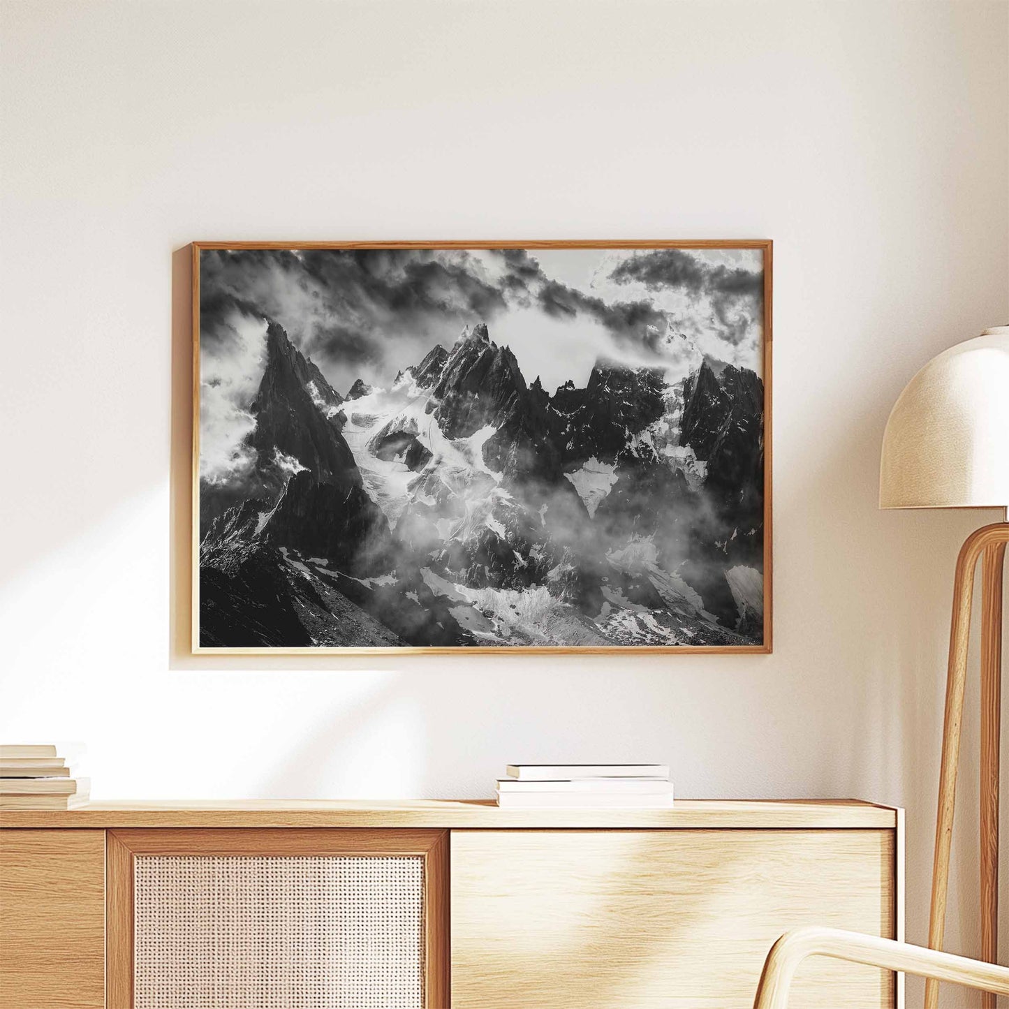 Elegant black and white mountain art of the Needles of Chamonix in a natural wooden frame, perfect for modern interiors.