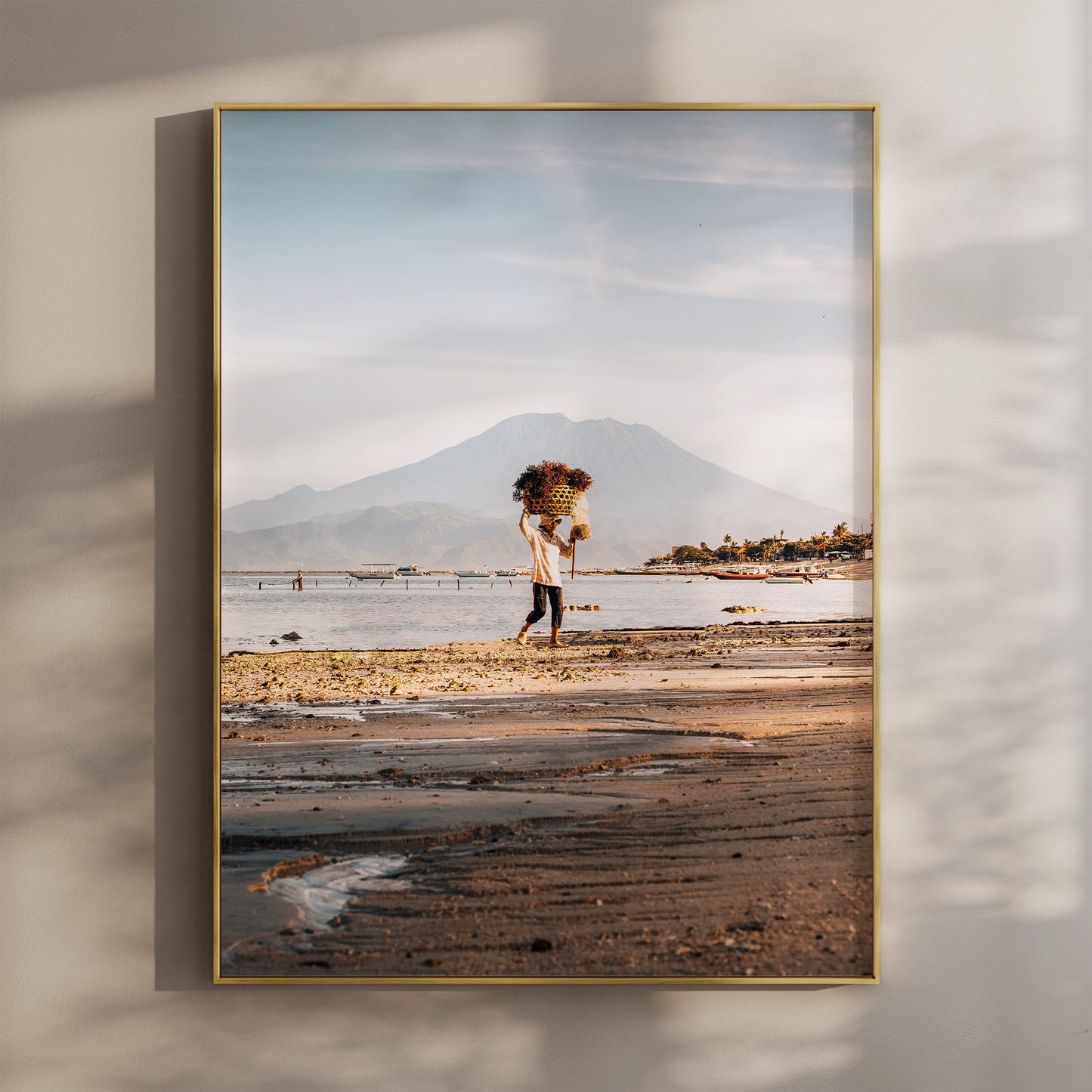 Nusa Lembongan seaweed farmer beach wall art print with Mount Agung in gold floating frame mounted on beige wall with natural shadows