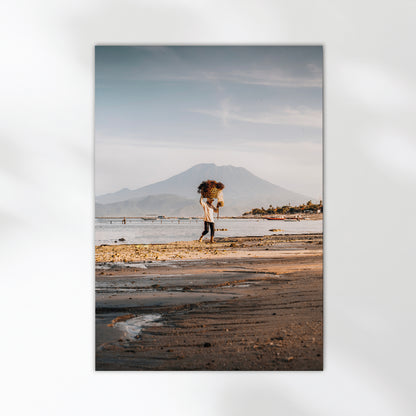 Nusa Lembongan seaweed farmer carrying basket on beach with Mount Agung travel photography print unframed on white background
