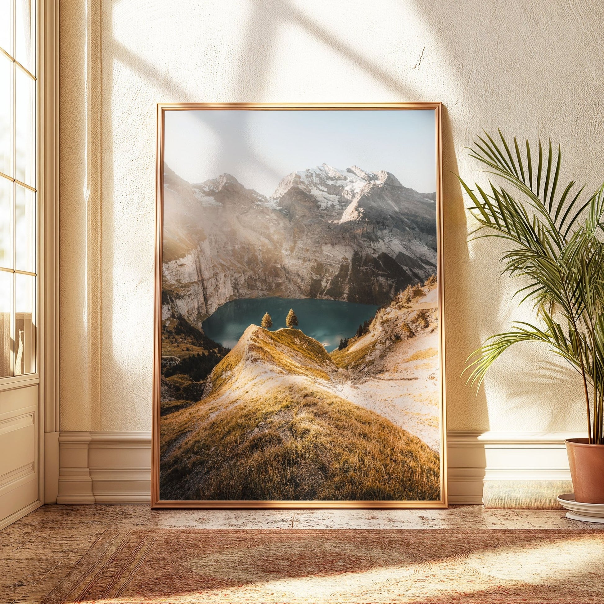 Oeschinensee lake in the Swiss Alps, bathed in sunlight, framed in a light gold finish.