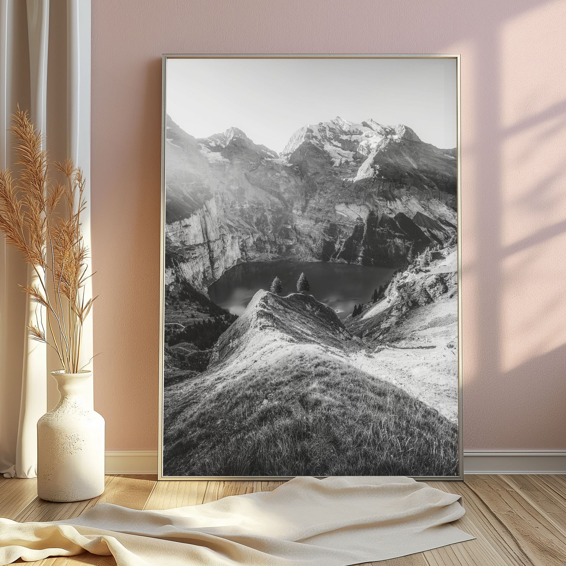 Oeschinensee in the Swiss Alps in monochrome, featuring a serene mountain lake view with textured grass and evening light for timeless decor.