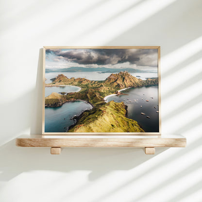 Gold framed aerial print of Padar Island Komodo National Park Flores Indonesia on a minimalist wall shelf with soft natural light