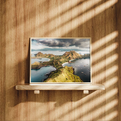 Natural wood framed Padar Island Komodo National Park Flores Indonesia aerial print displayed on a wooden shelf