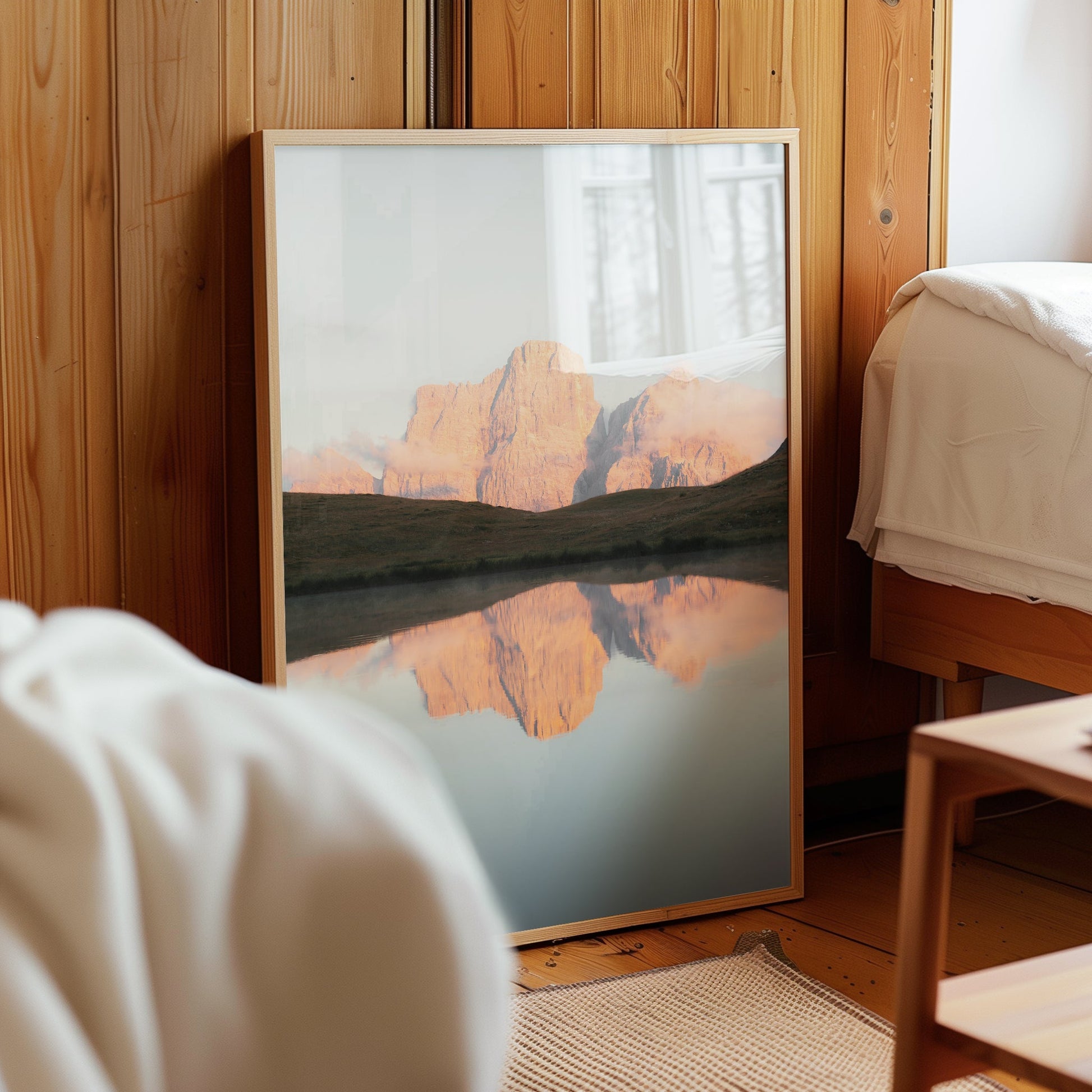 Dolomites mountain print leaning on wooden wall in cosy interior