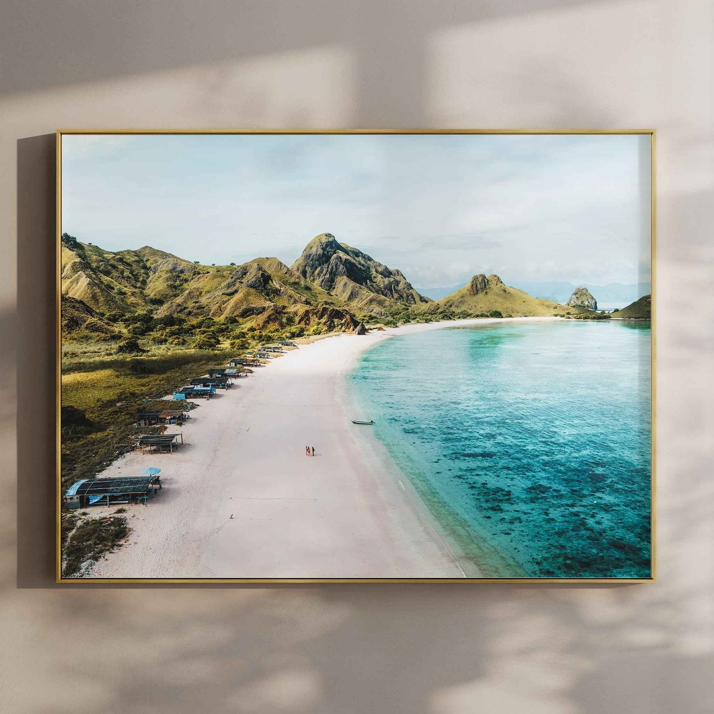 Pink Beach Padar Island Komodo National Park aerial wall art print in gold floating frame mounted on beige wall with natural shadows