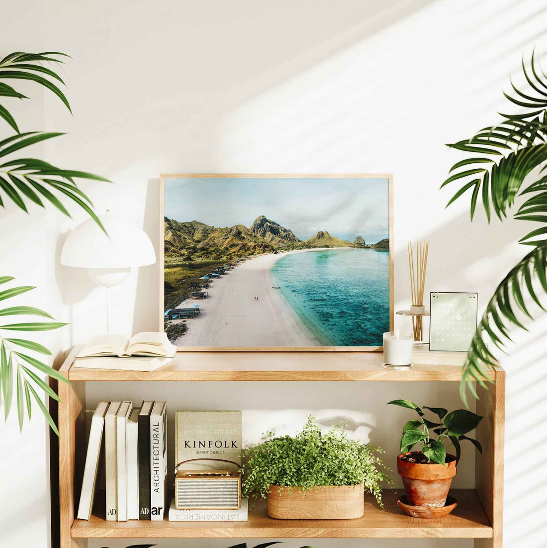 Pink Beach Padar Island Komodo National Park large framed wall art print in natural wood frame on bookshelf with plants and Kinfolk book