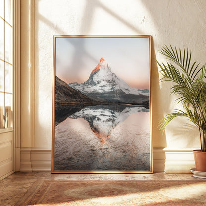 Golden morning light on Riffelsee and the Matterhorn, framed in light gold, bathed in soft sunlight