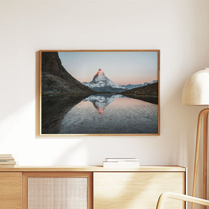 Alpine reflection of the Matterhorn on Rifflesee lake, surrounded by stunning mountain landscapes in the morning light.