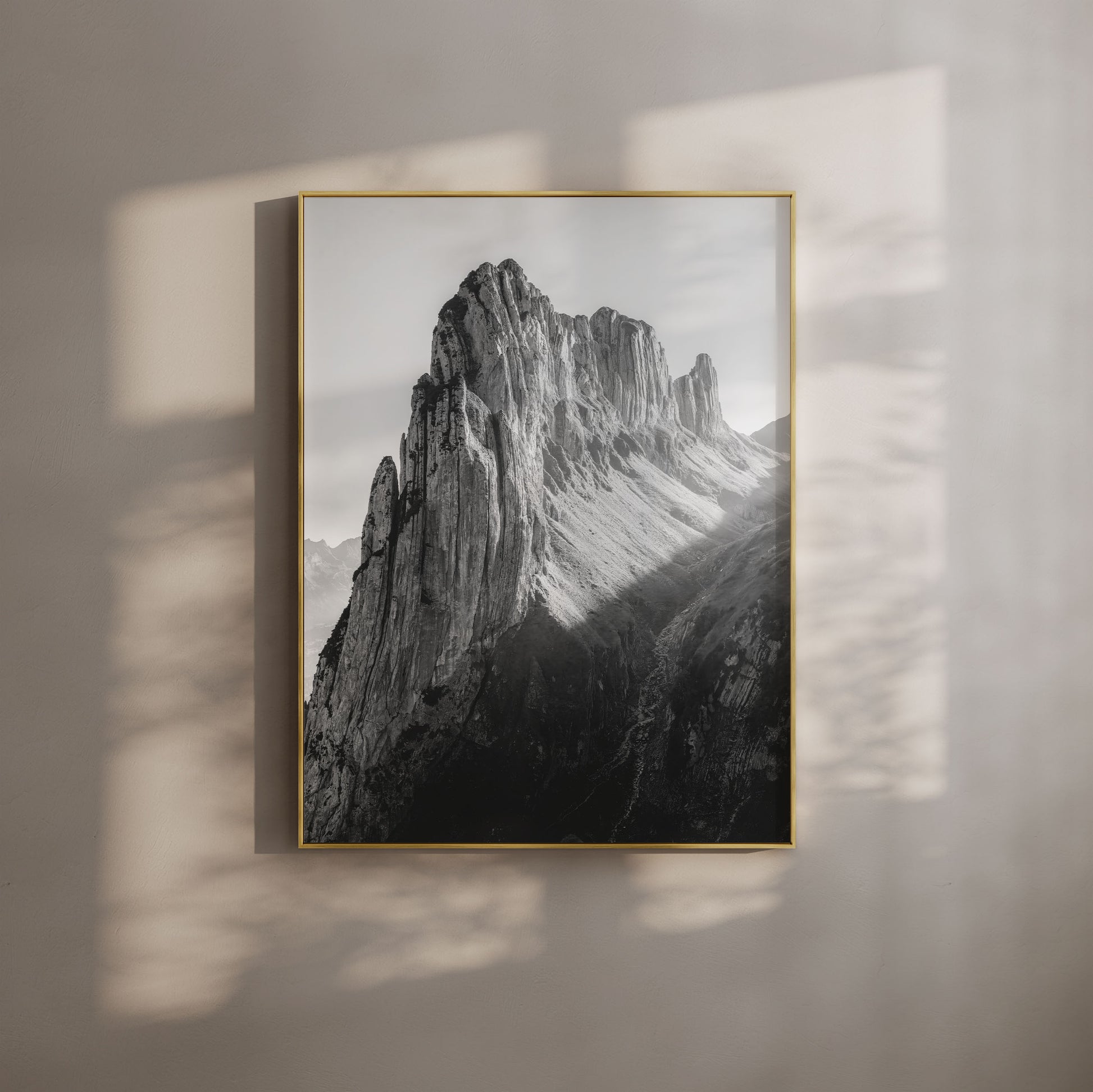 Black-and-white Saxer Lücke ridgeline in Appenzell, Switzerland, captured during evening light with dramatic alpine peaks and shadowed cliffs.