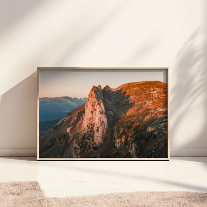 Saxer Lucke mountain peaks under a glowing morning sky, showcasing the beauty of Appenzell.