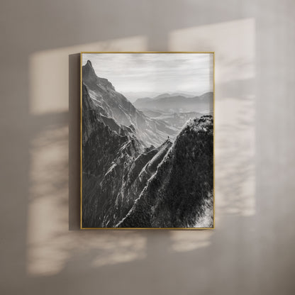 Black-and-white Schäfler ridgeline in Appenzell, Switzerland, with evening light highlighting the dramatic alpine peaks and valleys.