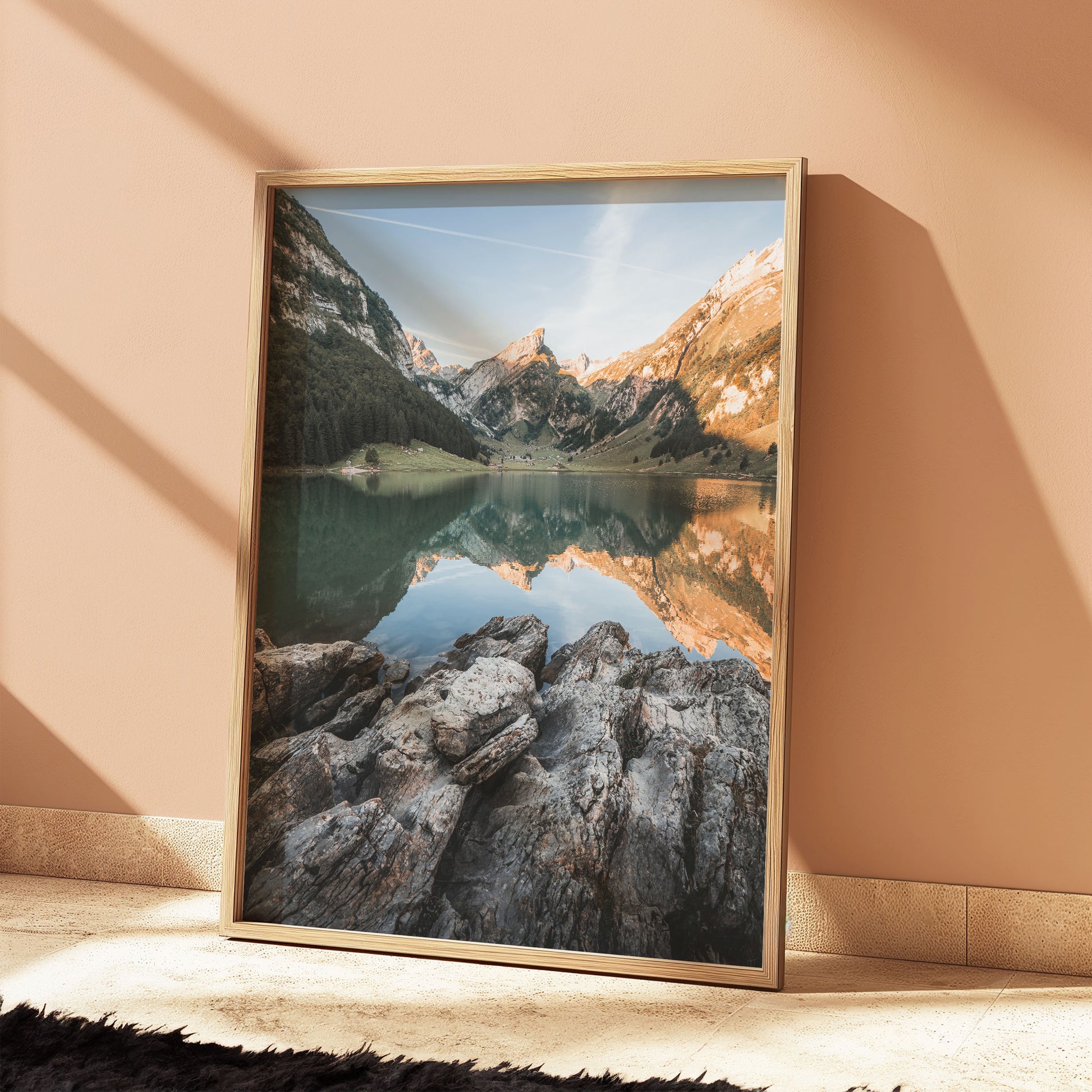 Morning at Seealpsee Lake, Swiss Alps, showcasing stunning mountain reflections and rocky shoreline, ideal mountain wall art piece.