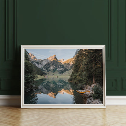 Beautiful Seealpsee in the Swiss Alps with sunset light over the mountains and clear reflections in the water.