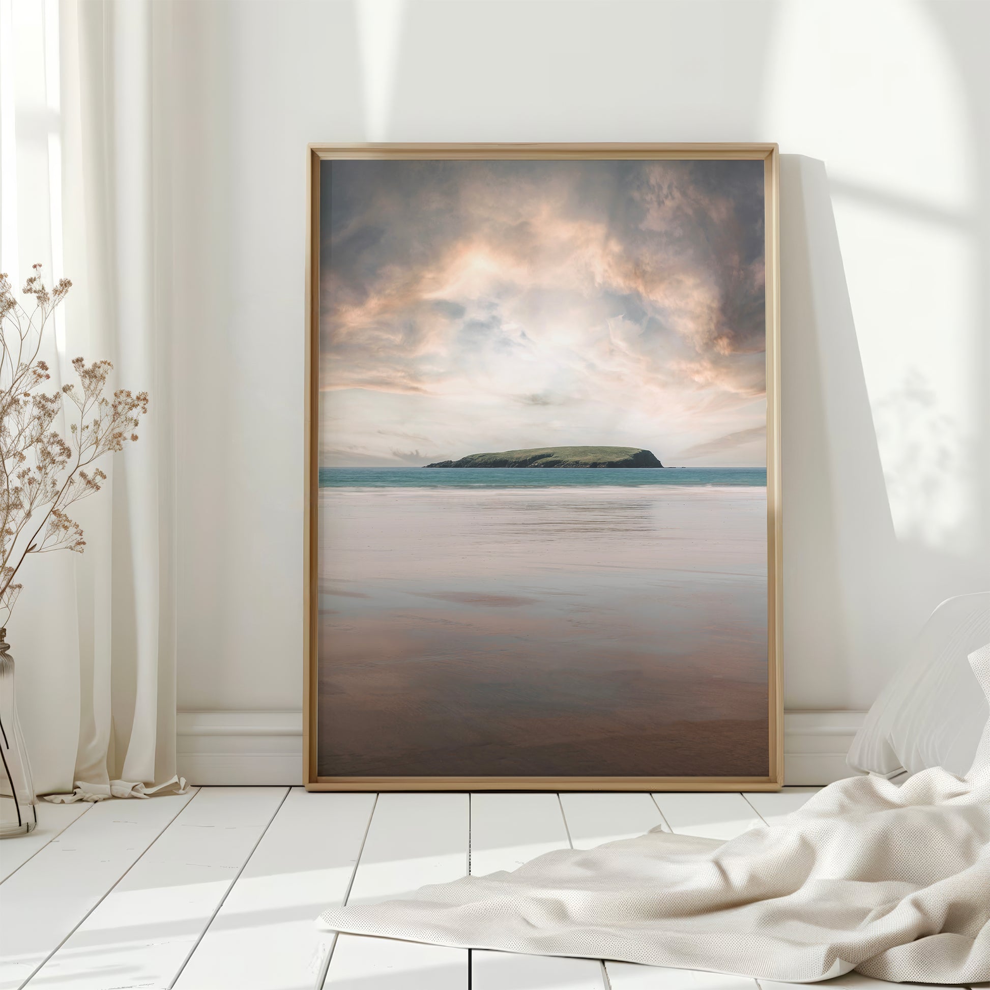 Framed Achill Island coastal print with white wood flooring and soft morning light