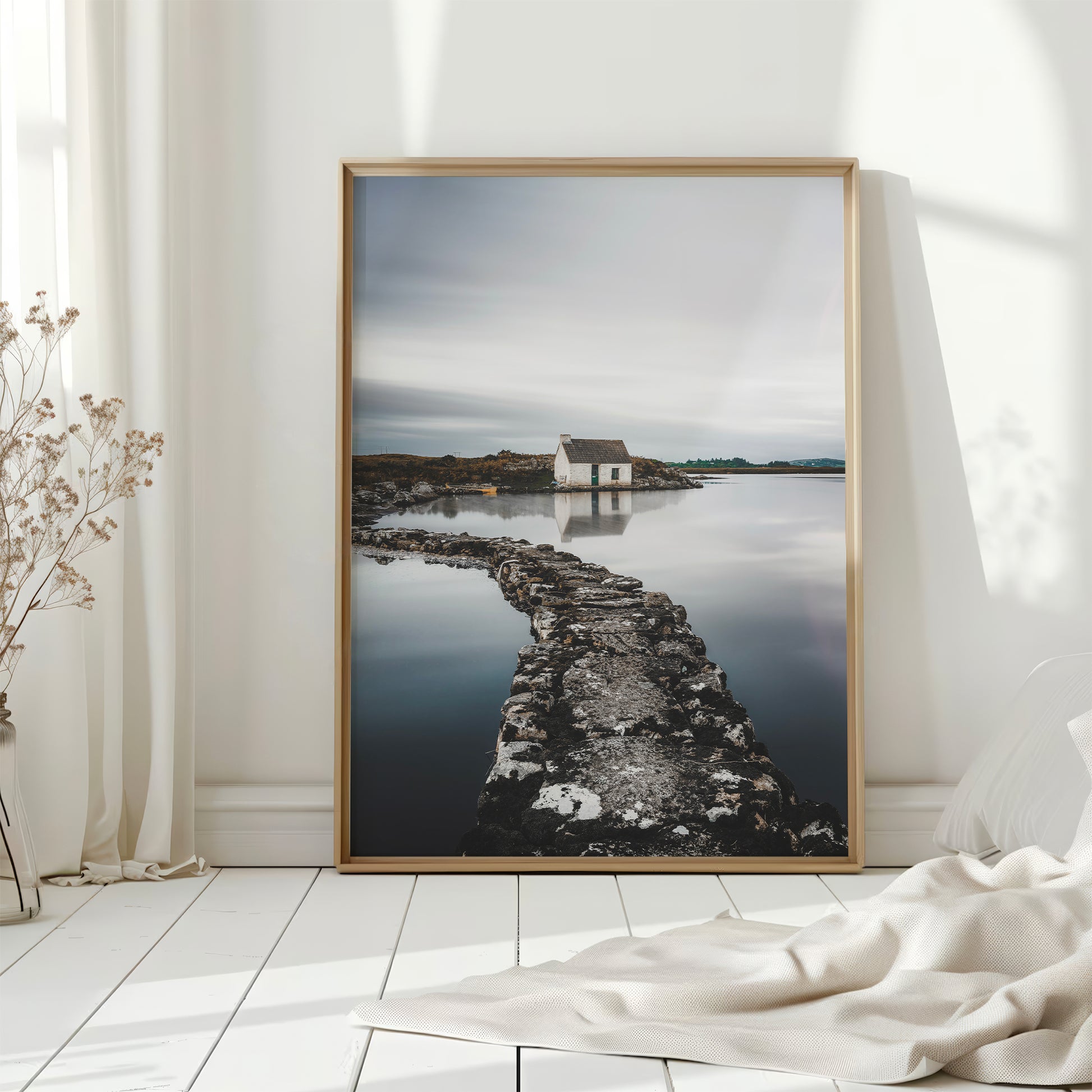 Irish coastal hut print in soft light with curtains and white flooring