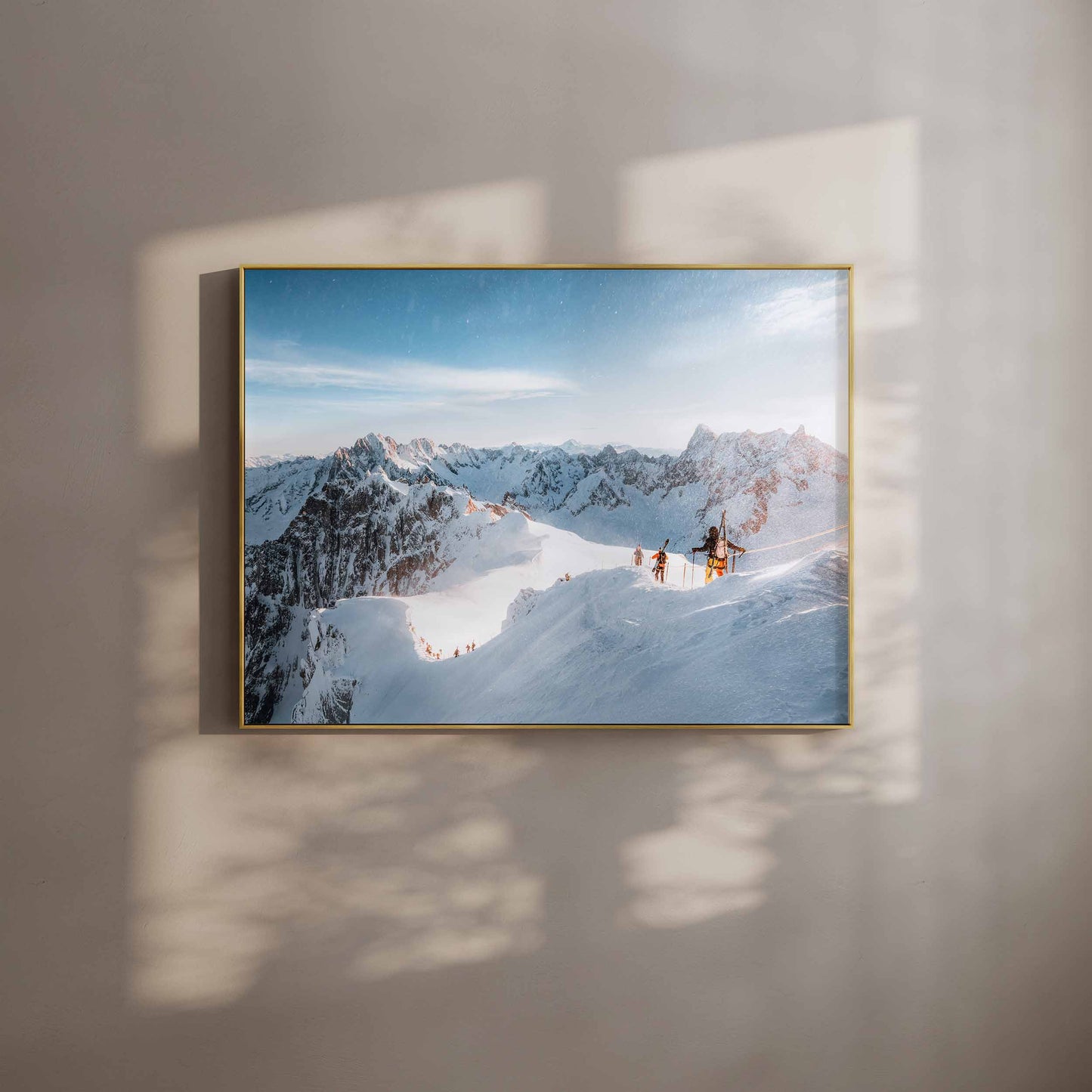 Skiers descending the Vallée Blanche in Chamonix under a clear blue sky, framed wall art