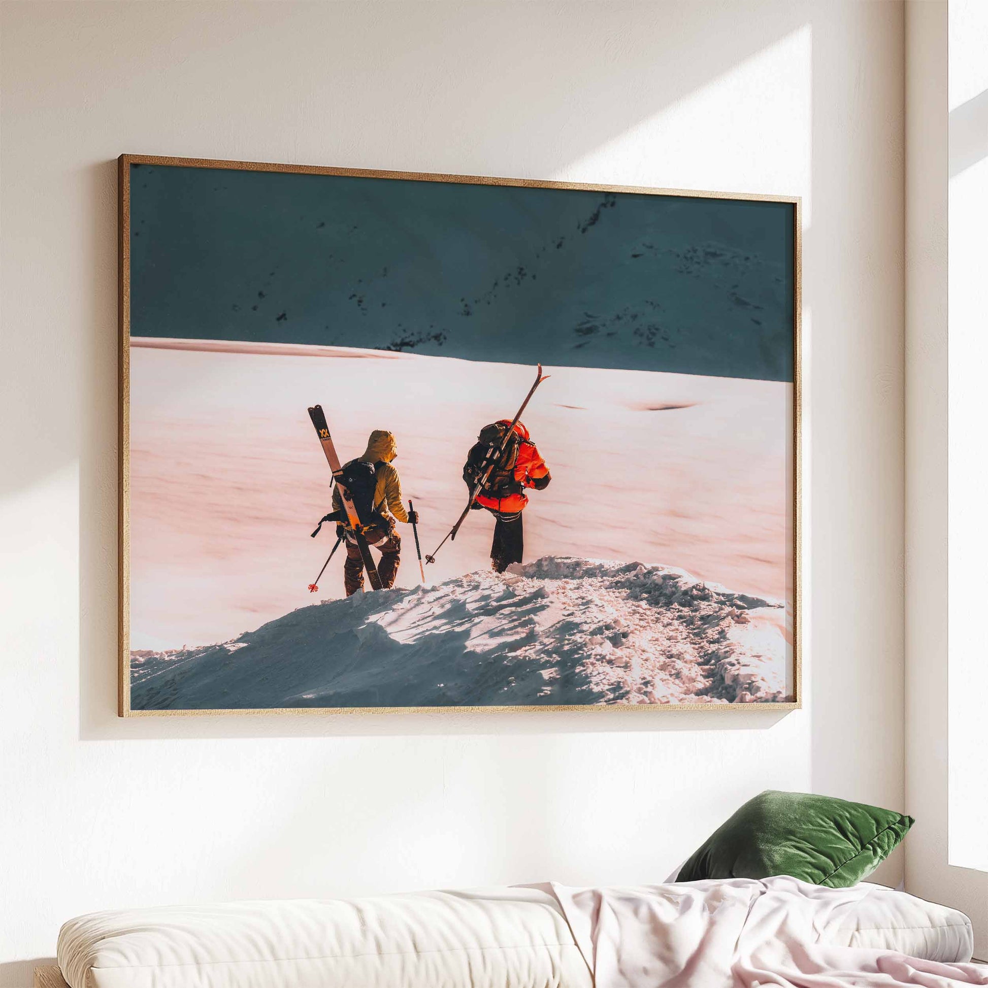 Skiers on the Midi Arête in Chamonix, wall art above a sofa in a modern living room.