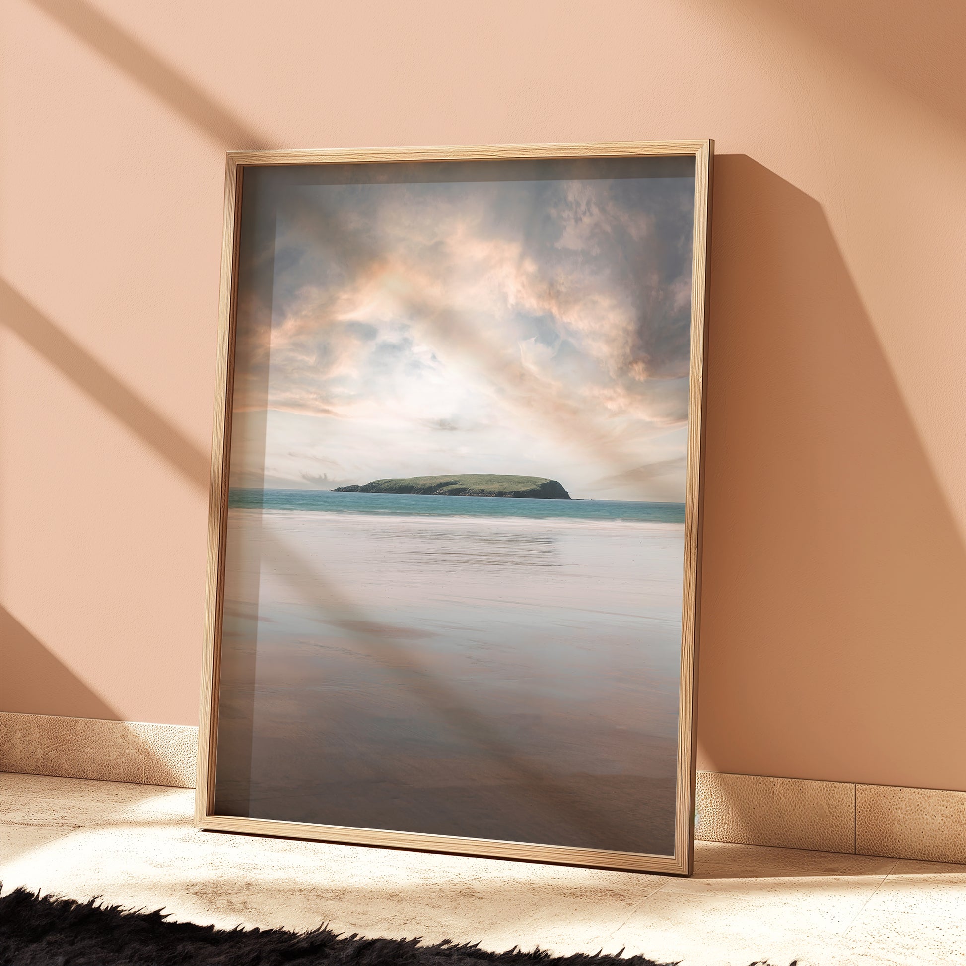 Irish beach print of Keel with golden skies and ocean horizon in a peach-toned room