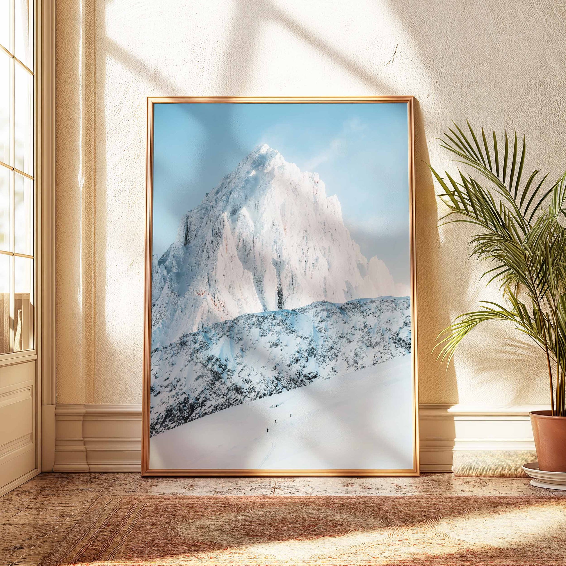 Three ski tourers in Chamonix, snowy mountain backdrop in a light wood frame