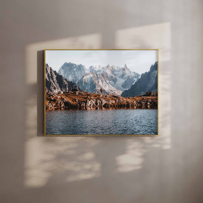 Wall art of a hiker on the Tour du Mont Blanc with mountain reflections in golden light