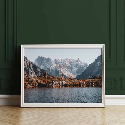 Chamonix-inspired artwork with a hiker and mountain reflections, framed in a modern setting