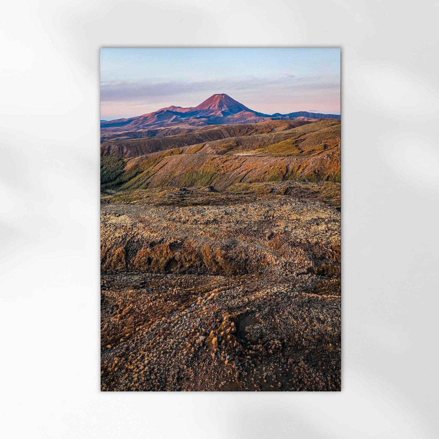 Unframed volcanic landscape fine art print on white background showing red-coned volcano and lava fields