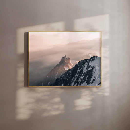 Aiguille du Midi wall art print with a golden frame in warm ambient light.