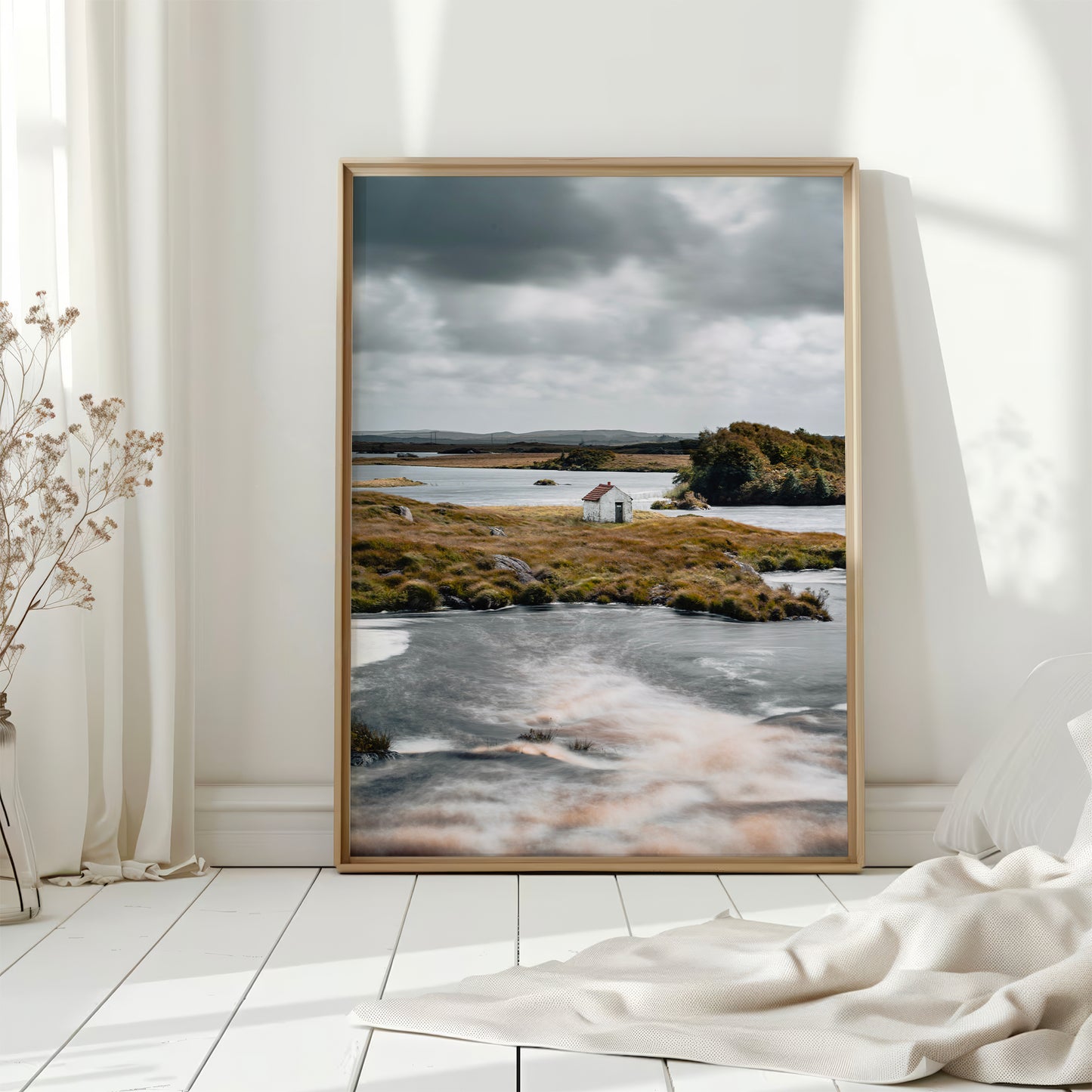 Connemara hut landscape print displayed in a sunlit interior on white wooden flooring