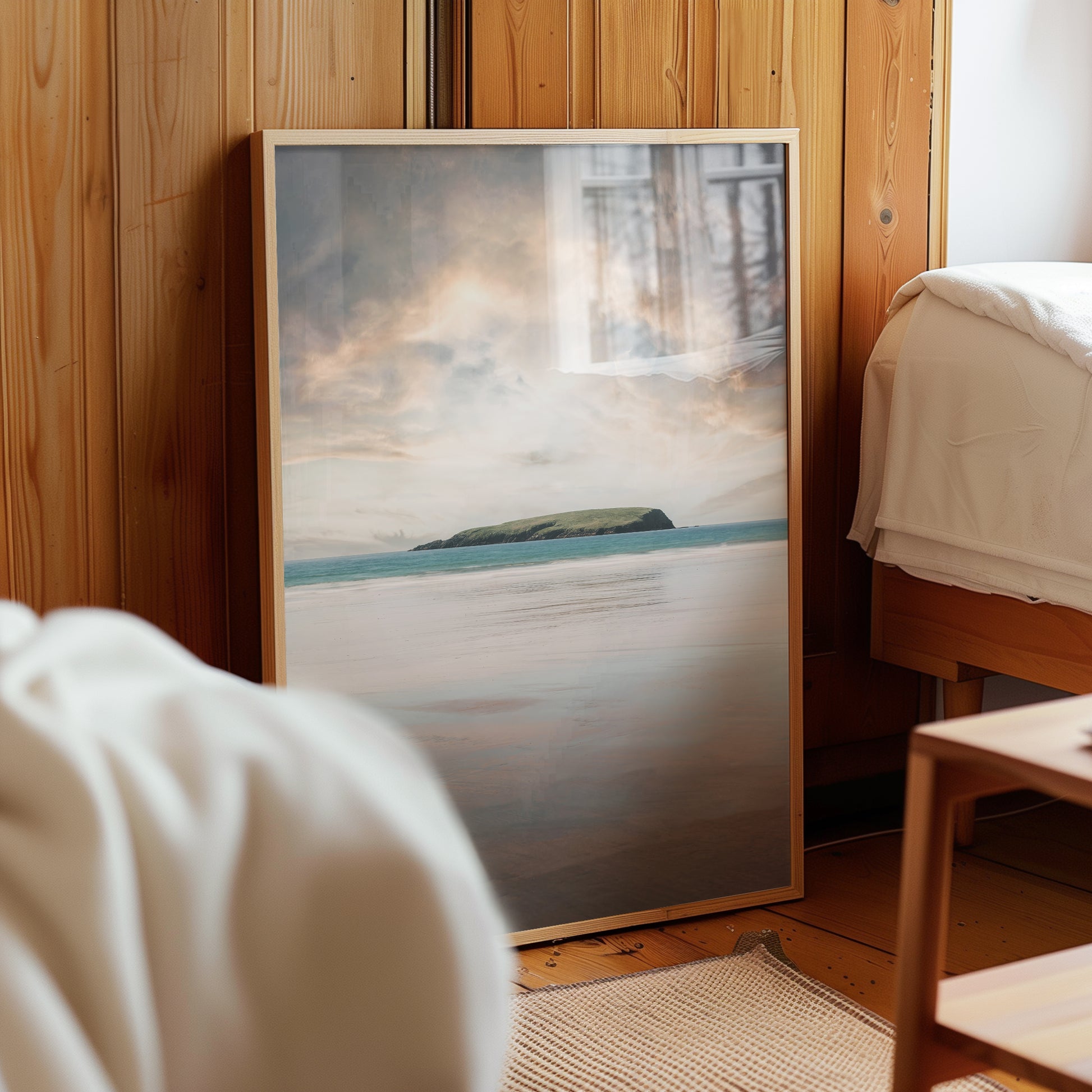 Keel Beach wall art print styled in a rustic wooden room beside a bed