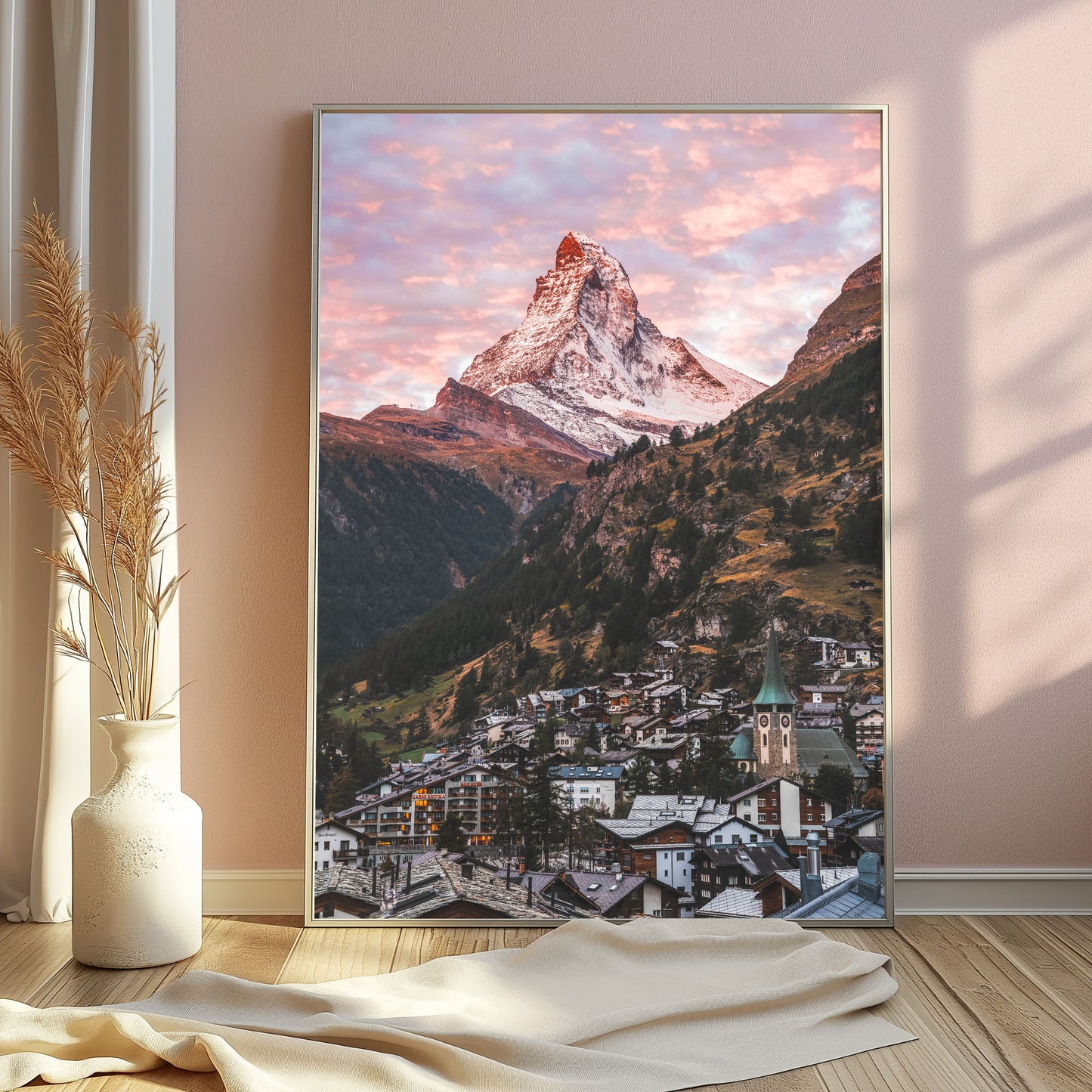 Sunlit Zermatt village beneath the Matterhorn, offering a serene mountain scene perfect for wall art enthusiasts.