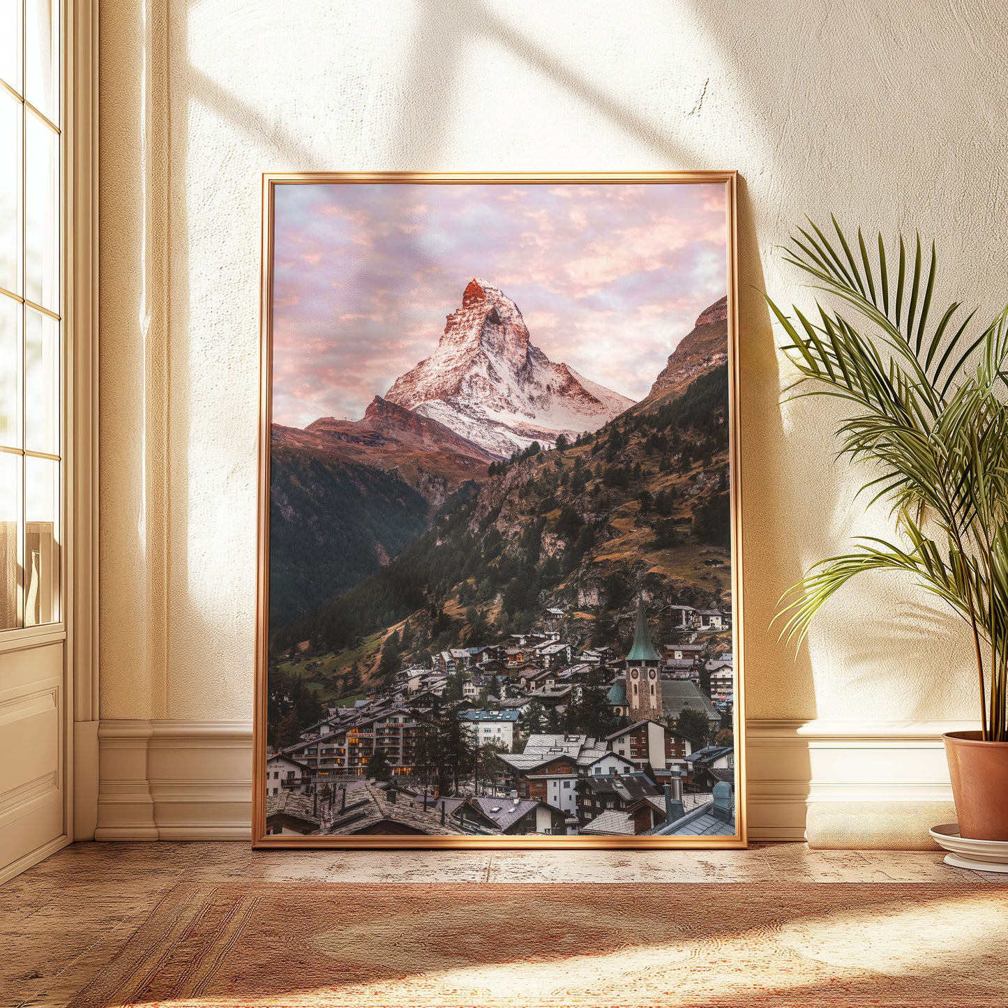 Morning view of Zermatt and the iconic Matterhorn mountain with a glowing pink sky, ideal for mountain wall art decor.